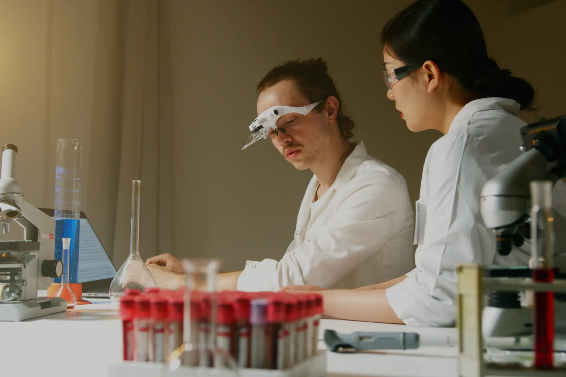Scientists collaborating on process development in a laboratory