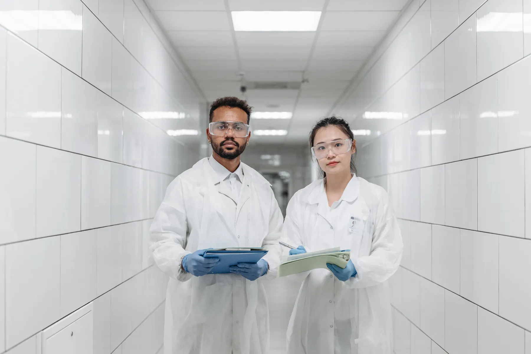 Two laboratory professionals in a modern research facility